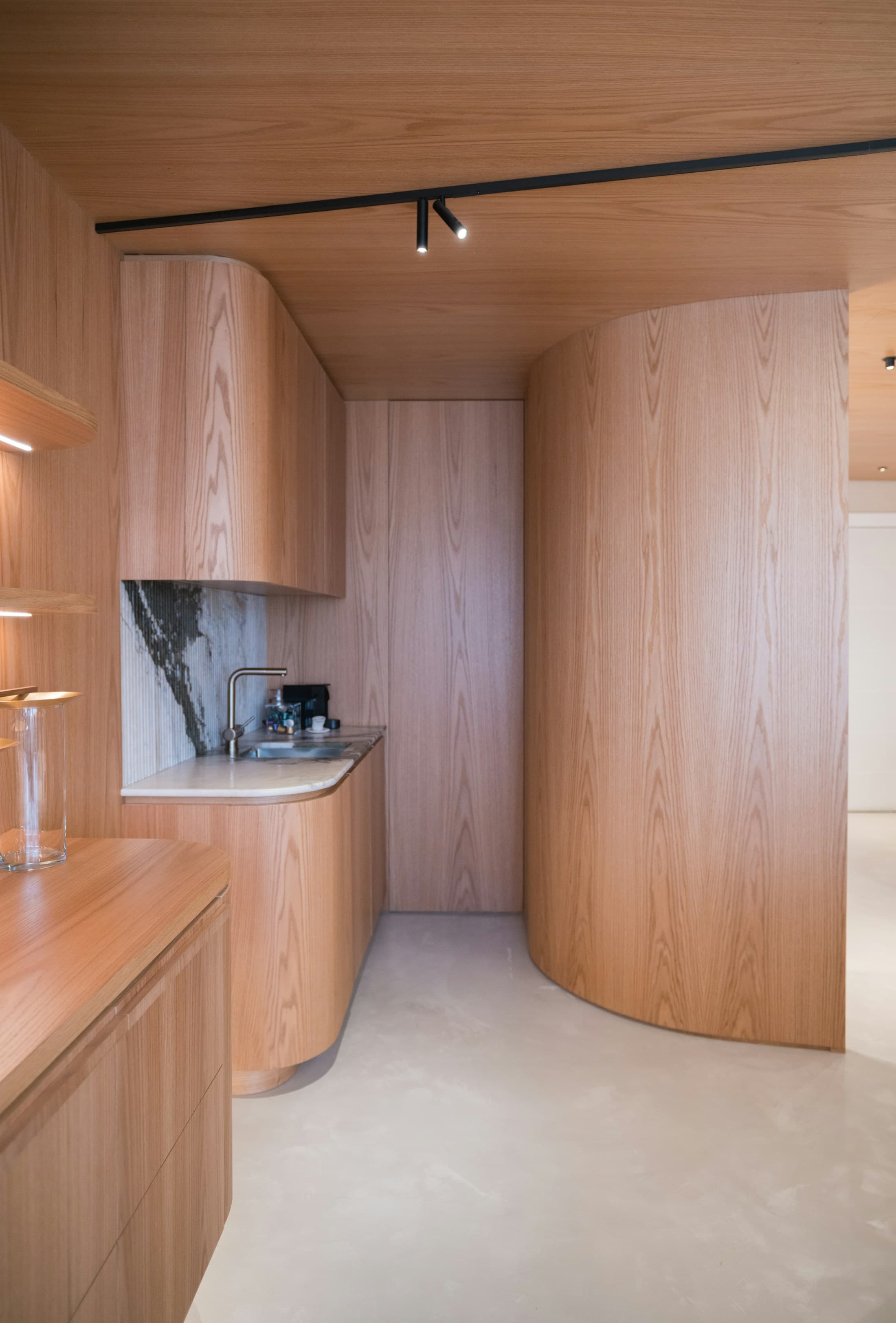 Refined kitchen with oak cabinetry and marble