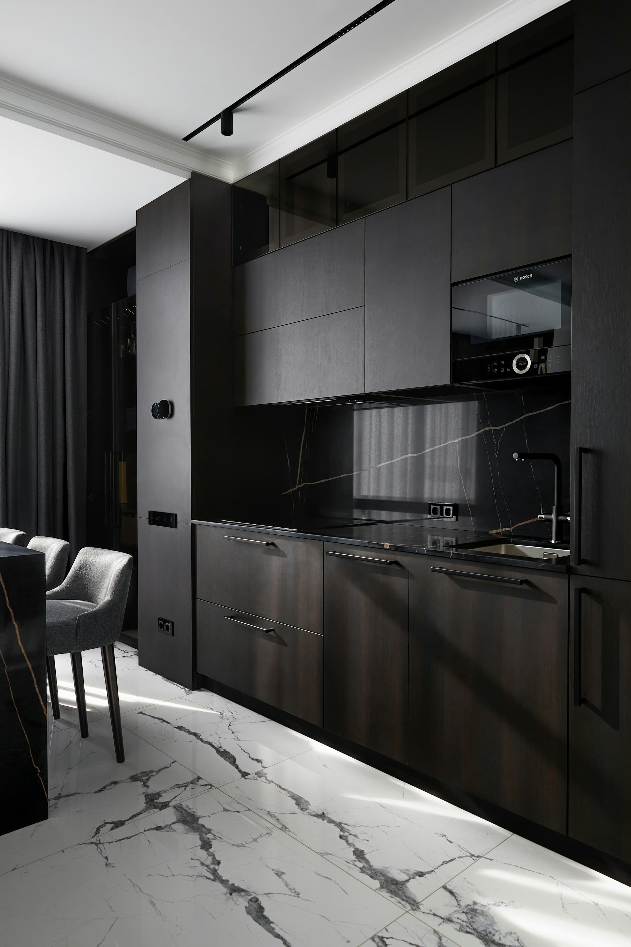 Premium dark kitchen with marble surfaces